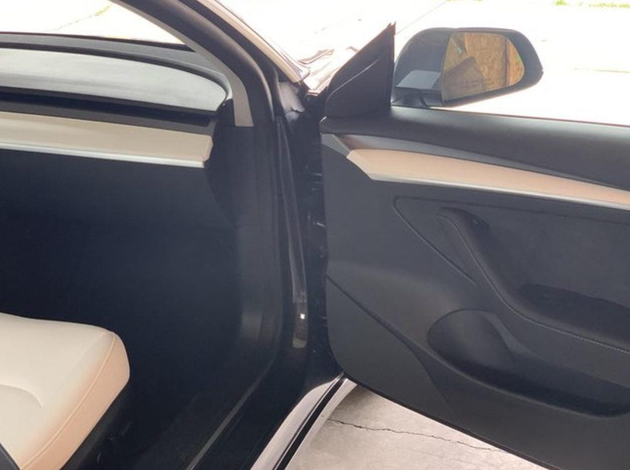 Here is a Tesla Model 3 with New White Door Trims Delivered in