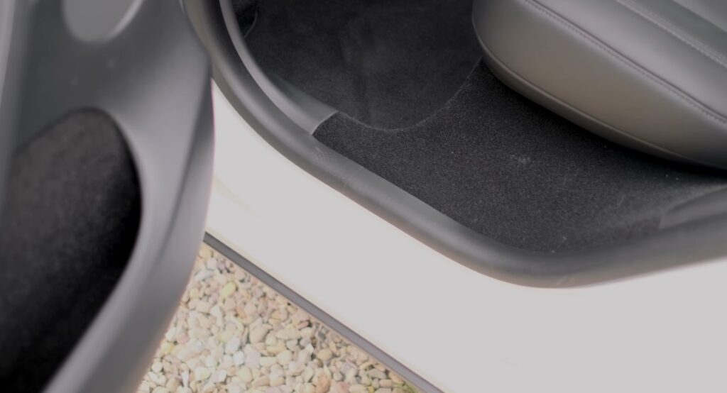Tesla Model Y Gets New Door Bin Lights, Carpeted Rear Door Sills