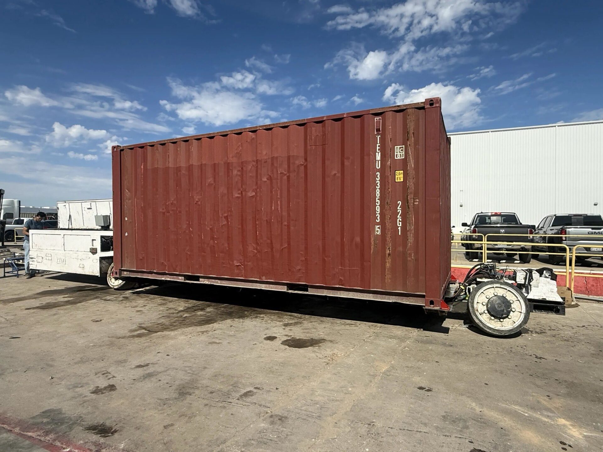 The Boring Company's modified Prufrock Liner Truck carrying a standard 20-foot shipping container