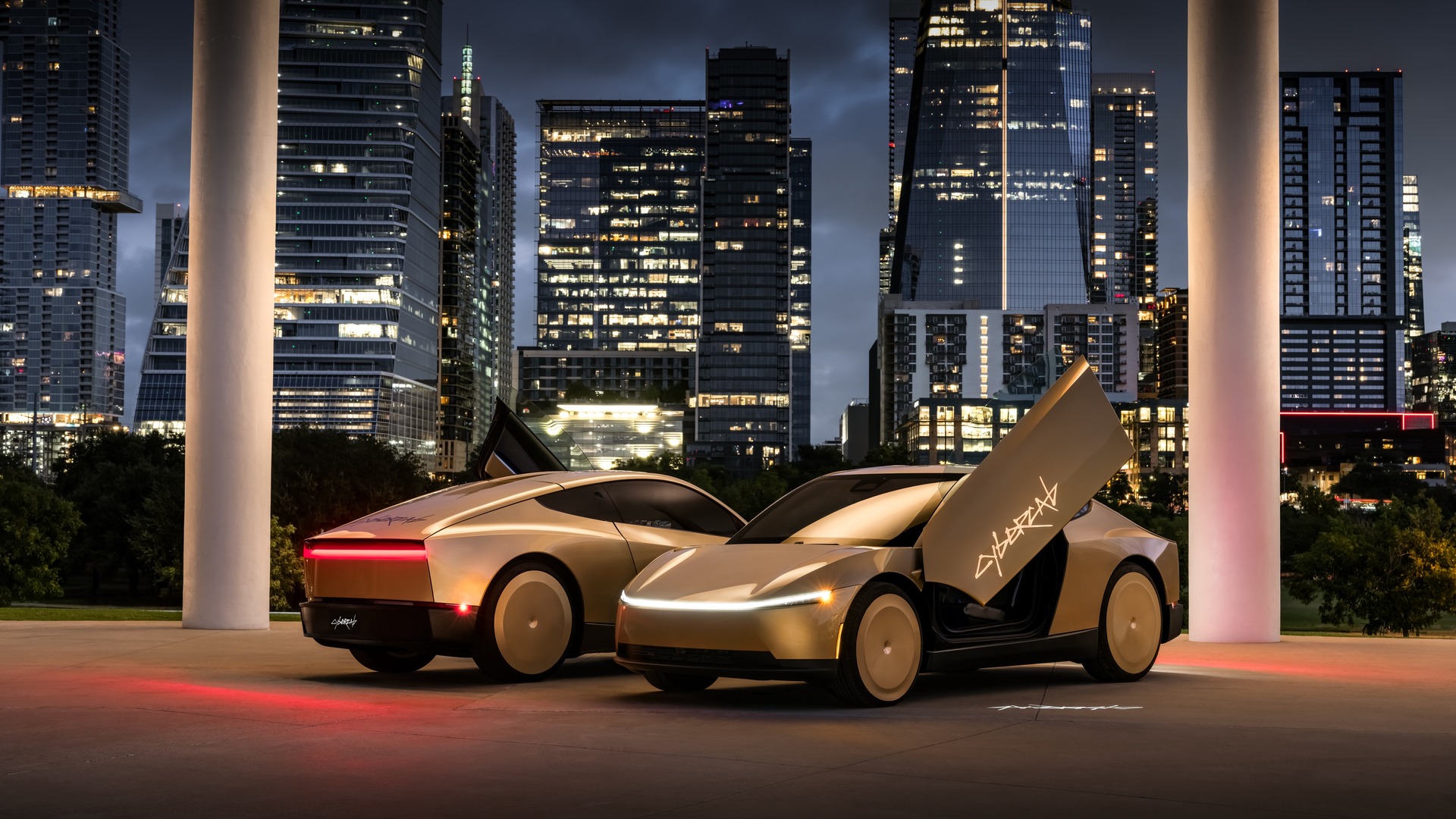 Two futuristic white sports cars with gull-wing doors open in an urban plaza at night, sleek designs reflecting city lights and tall glass skyscrapers in the background.