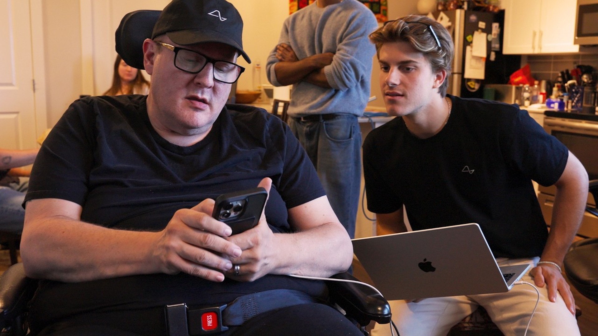 featured-1920x1080 | TeslaNorth.com Neuralink engineers work beside VOICE study participant Kenneth during a home speech hackathon