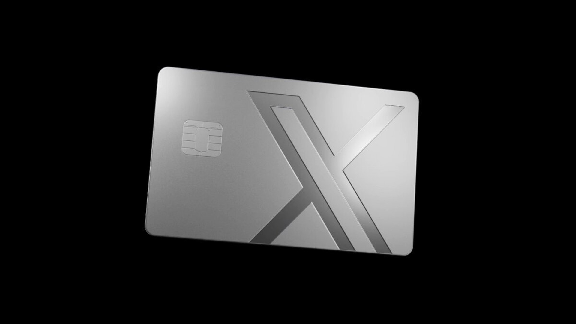 Silver X Money Card with embossed X logo on a black background