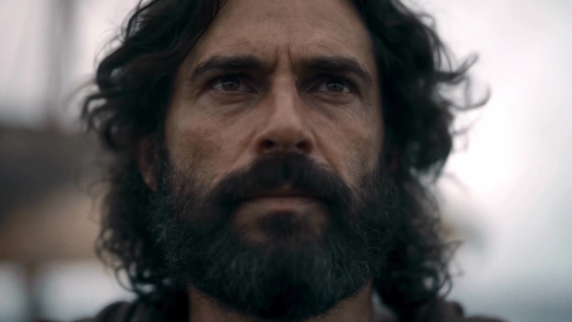 The bearded lead of Grok Imagine's AI-made Odyssey series in episode 1