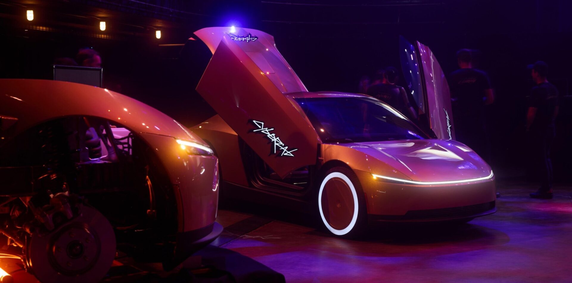 Tesla Cybercab with its doors open at the Austin Robotaxi launch