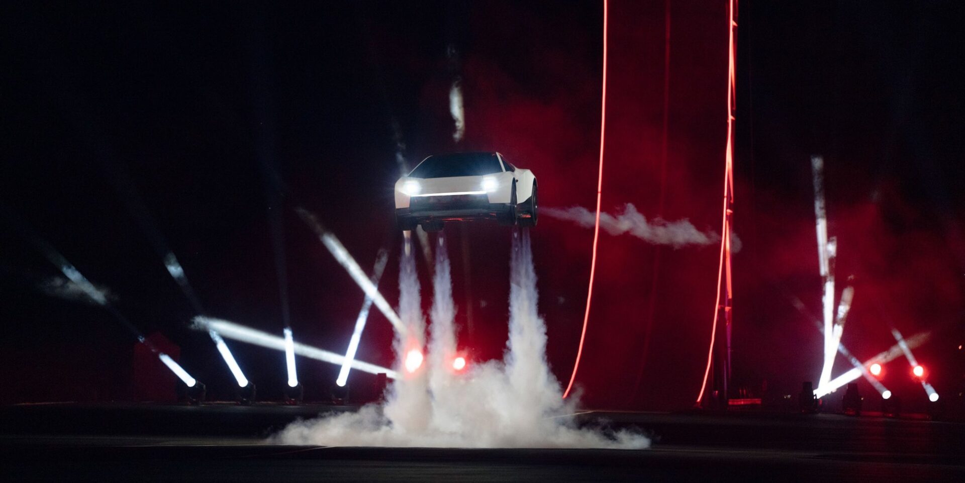 Tesla Next Gen Roadster hovering above the ground on thruster exhaust at its reveal event