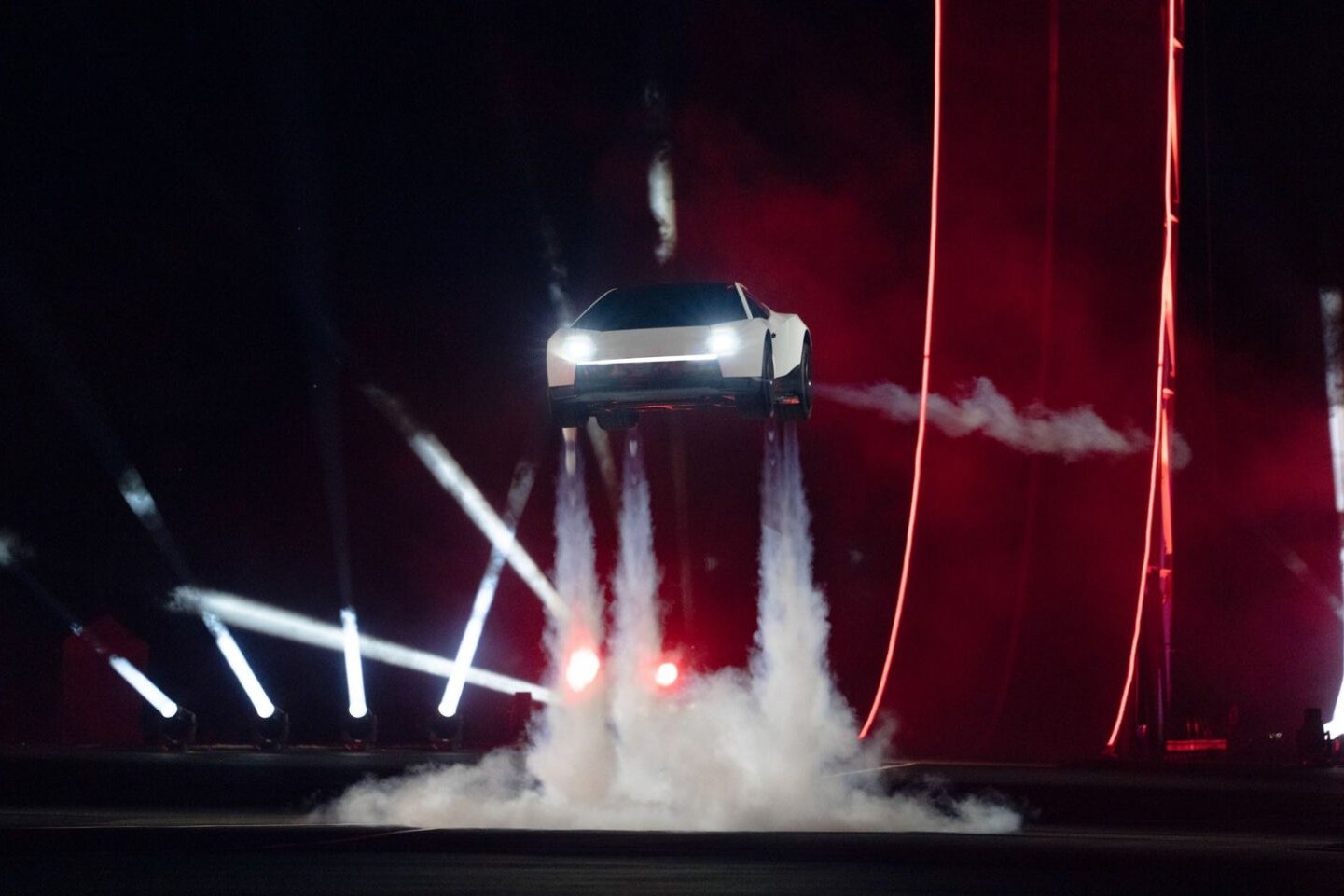 Tesla Next Gen Roadster hovering above the ground on cold gas thruster exhaust at its reveal event.
