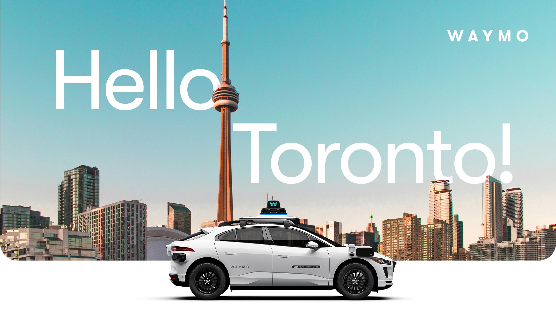 Waymo's Hello Toronto graphic with a white Waymo Jaguar I-PACE in front of the CN Tower and the Toronto skyline